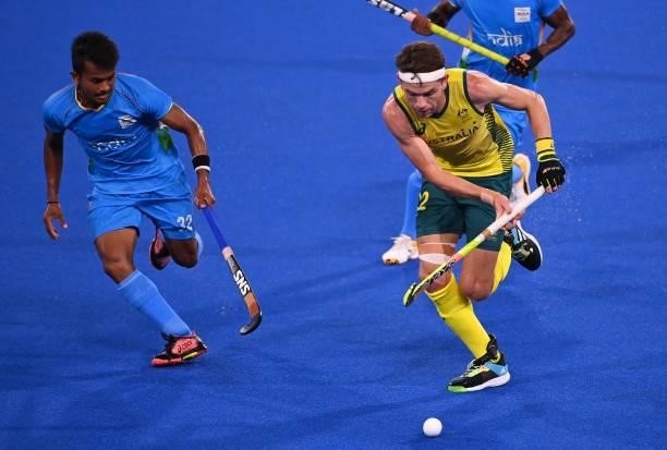 Australia's Flynn Andrew Ogilvie is marked by India's Harmanpreet Singh during their men's pool A match of the Tokyo 2020 Olympic Games field hockey...
