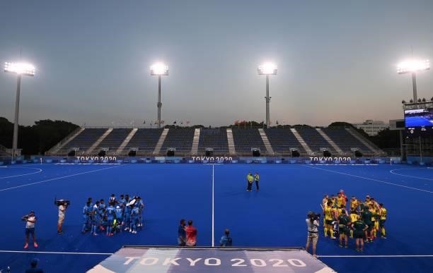 Players of India and Australia gather during quarters during their men's pool A match of the Tokyo 2020 Olympic Games field hockey competition, at...