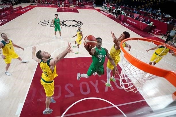 Nigeria's Caleb Agada goes to the basket in the men's preliminary round group B basketball match between Australia and Nigeria during the Tokyo 2020...