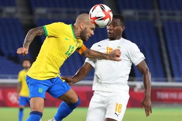 Brazil's defender Dani Alves fights for the ball with Ivory Coast's midfielder Cheick Timite during the Tokyo 2020 Olympic Games men's group D first...
