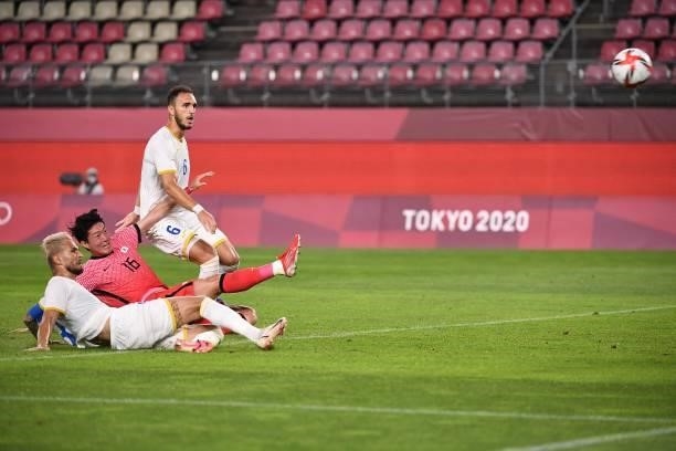 South Korea's forward Hwang Ui-jo shoots but fails to score during the Tokyo 2020 Olympic Games men's group B first round football match between...
