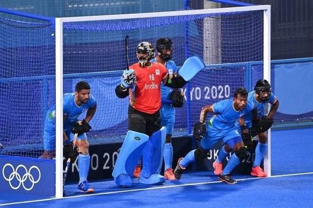 India's goalkeeper Sreejesh Parattu Raveendran and teammates defend their goal during a penalty corner in favour of Australia during their men's pool...