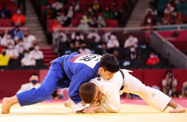 South Korea's An Baul competes with Italy's Manuel Lombardo during their judo men's -66kg bronze medal A bout during the Tokyo 2020 Olympic Games at...
