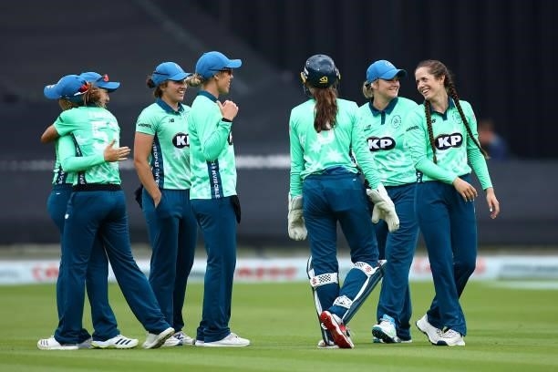 Fran Wilson of Oval Invincibles celebrates with team mates after running out Deepti Sharma of London Spirit during the Hundred match between London...