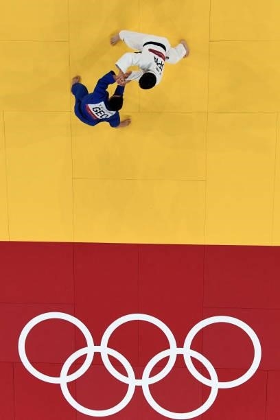 Japan's Hifumi Abe competes with Georgia's Vazha Margvelashvili during their judo men's -66kg final bout during the Tokyo 2020 Olympic Games at the...