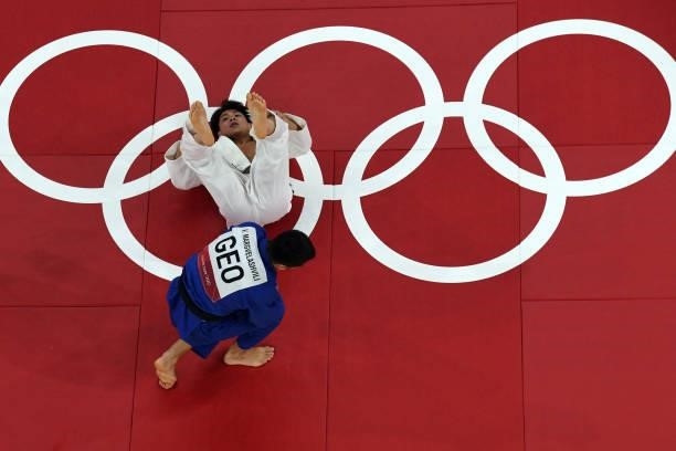 Japan's Hifumi Abe competes with Georgia's Vazha Margvelashvili during their judo men's -66kg final bout during the Tokyo 2020 Olympic Games at the...