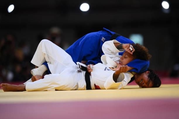France's Amandine Buchard competes with Japan's Uta Abe during their judo women's -52kg final bout during the Tokyo 2020 Olympic Games at the Nippon...