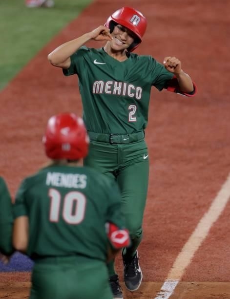 Mexico's Sydney Romero is all smiles while running on the base after her home run during the second inning of the Tokyo 2020 Olympic Games softball...