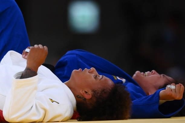 France's Amandine Buchard reacts after losing the judo women's -52kg final bout against Japan's Uta Abe during the Tokyo 2020 Olympic Games at the...