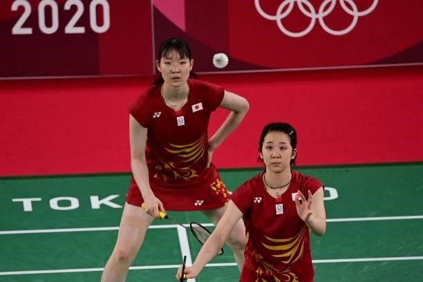 Japan's Wakana Nagahara and Japan's Mayu Matsumoto eye the shuttlecock during a point in their women's doubles badminton group stage match against...