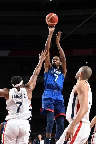 S Kevin Wayne Durant takes a shot as France's Guerschon Yabusele tries to block during the men's preliminary round group A basketball match between...