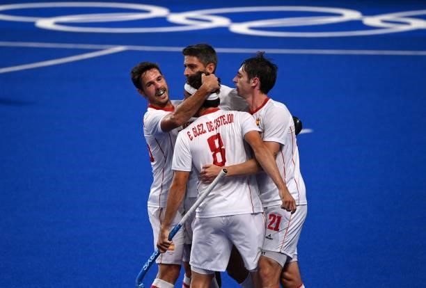 Spain's Enrique Gonzalez celebrates with teammates after scoring against New Zealand during their men's pool A match of the Tokyo 2020 Olympic Games...