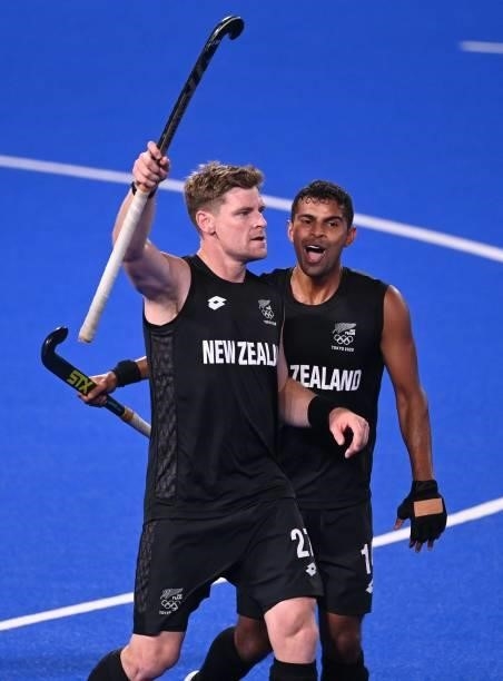 New Zealand's Stephen Jenness celebrate with teammate Jared Panchia after scoring against Spain during their men's pool A match of the Tokyo 2020...