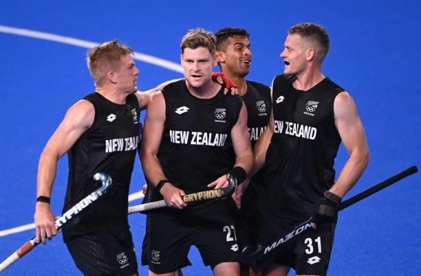New Zealand's Stephen Jenness celebrates with teammates after scoring against Spain during their men's pool A match of the Tokyo 2020 Olympic Games...