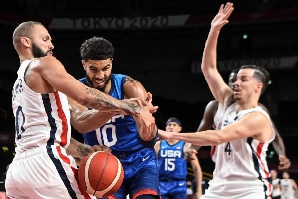 S Jayson Tatum fights for the ball with France's Evan Fournier during the men's preliminary round group A basketball match between France and USA...