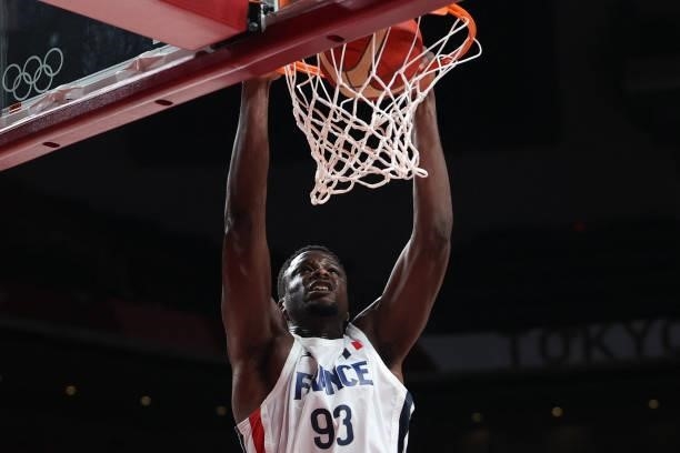 France's Moustapha Fall scores a basket in the men's preliminary round group A basketball match between France and USA during the Tokyo 2020 Olympic...