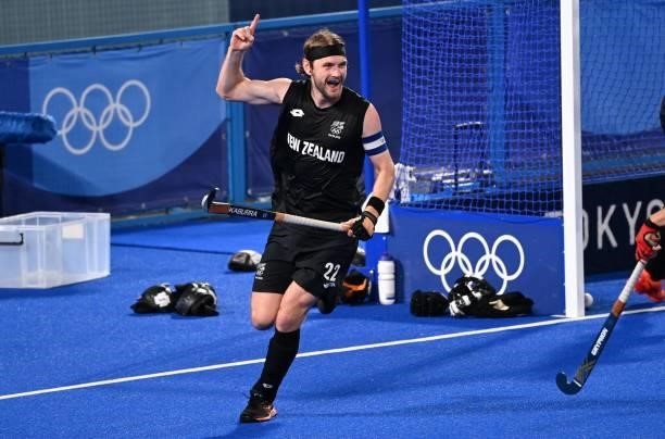 New Zealand's Blair Tarrant celebrates after scoring against Spain during their men's pool A match of the Tokyo 2020 Olympic Games field hockey...