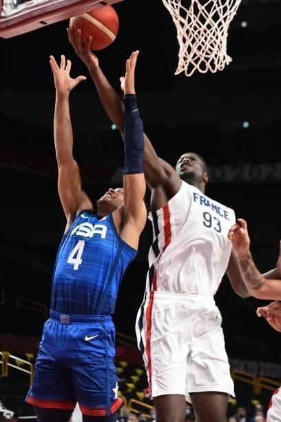France's Moustapha Fall goes for the basket past USA's Keldon Johnson during the men's preliminary round group A basketball match between France and...