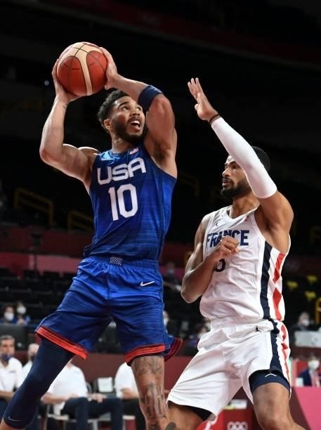 S Jayson Tatum goes for the basket past France's Timothe Luwawu Kongbo during the men's preliminary round group A basketball match between France and...