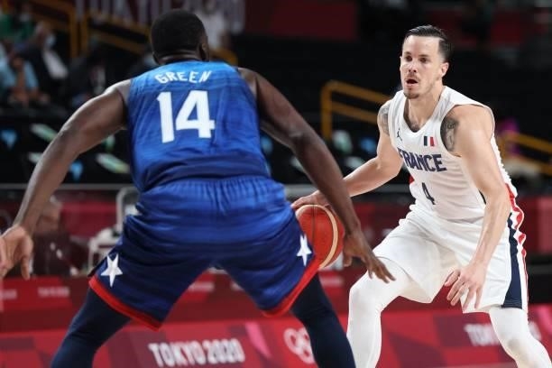 France's Thomas Heurtel dribbles the ball past USA's Draymond Jamal Green in the men's preliminary round group A basketball match between France and...