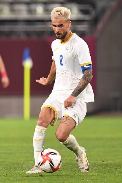 Romania's midfielder Marius Marin controls the ball during the Tokyo 2020 Olympic Games men's group B first round football match between Romania and...