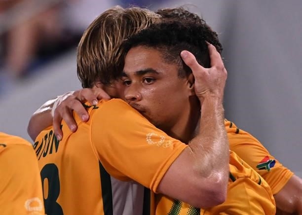 South Africa's Tevin Michael Kok celebrates with teammate Taine Paton after scoring against Netherlands during their men's pool B match of the Tokyo...