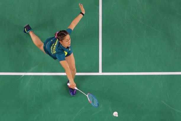 Australia's Gronya Somerville hits a shot in her mixed doubles badminton group stage match with Australia's Simon Wing Hang Leung against Japan's...