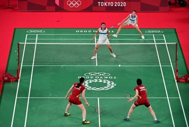 Canada's Rachel Honderich and Canada's Kristen Tsai look on during a point against Japan's Wakana Nagahara and Japan's Mayu Matsumoto in their...