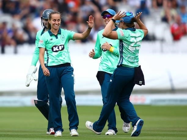 Tash Farrant of the Oval Invincibles celebrates with team mates after dismissing Freya Davies of London Spirit during the Hundred match between...