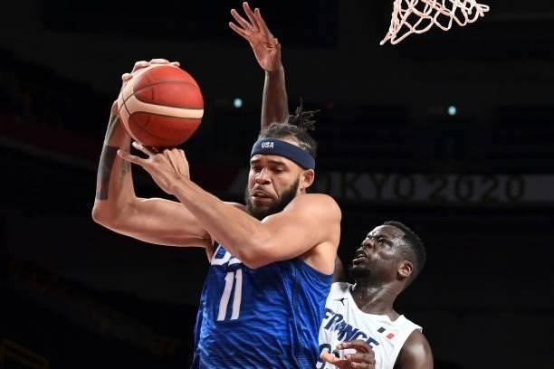 S Javale Mc Gee fights for the ball with France's Moustapha Fall during the men's preliminary round group A basketball match between France and USA...