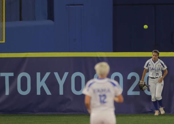 Italy's left fielder Laura Vigna gives up chasing the home run ball hit by Mexico's Anissa Urtez during the fifth inning of the Tokyo 2020 Olympic...