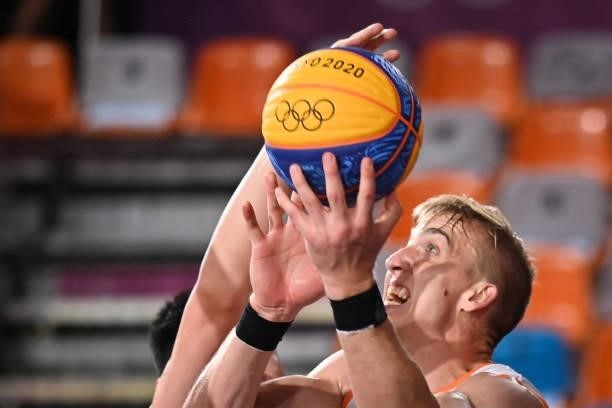 Netherlands' Ross Bekkering passes the ball during the men's first round 3x3 basketball match between Netherlands and China at the Aomi Urban Sports...