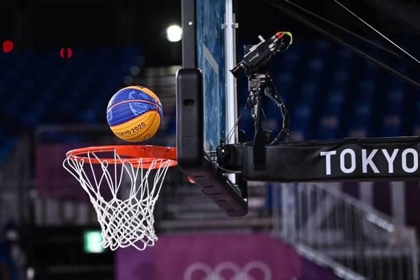 The ball is pictured entering the basket during the women's first round 3x3 basketball match between China and France at the Aomi Urban Sports Park...