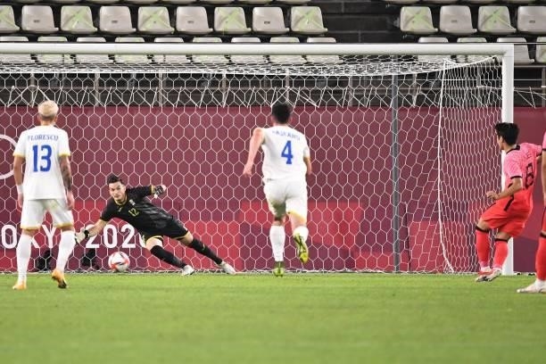 Romania's goalkeeper Marian Aioani concedes a goal to South Korea's midfielder Lee Kang-in during the Tokyo 2020 Olympic Games men's group B first...