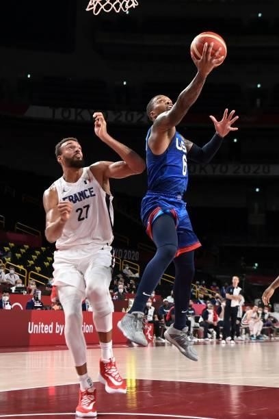 S Damian Lillard goes for the basket past France's Rudy Gobert during the men's preliminary round group A basketball match between France and USA...