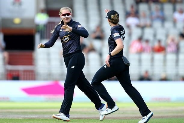 Sophie Ecclestone of the Manchester Orginals celebrates with team mate Kate Cross after taking the wicket of Erin Burns of Birmingham Phoenix during...