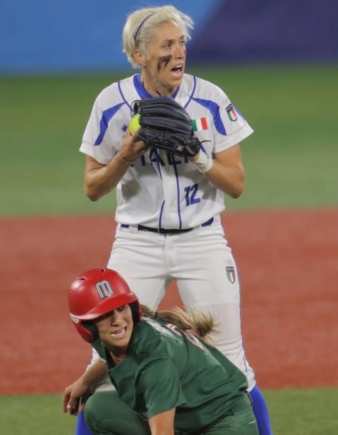 Italy's shortstop Amanda Fama appeals to referee as Mexico's Sydney Romero tagged out at the second base during the fifth inning of the Tokyo 2020...