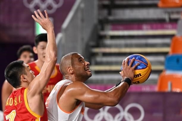 Netherlands' Dimeo Van Der Horst jumps to score during the men's first round 3x3 basketball match between Netherlands and China at the Aomi Urban...