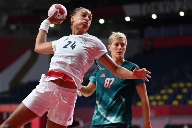 France's pivot Beatrice Edwige shoots past Hungary's left back Zsuzsanna Tomori during the women's preliminary round group B handball match between...