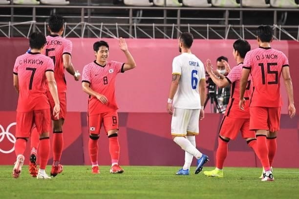 South Korea's midfielder Lee Kang-in celebrates after scoring a goal during the Tokyo 2020 Olympic Games men's group B first round football match...