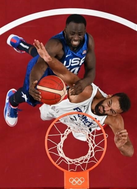 France's Rudy Gobert fights for the ball with USA's Draymond Jamal Green during the men's preliminary round group A basketball match between France...