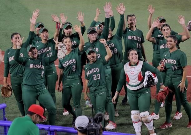 Mexico's player celebrate their victory during the Tokyo 2020 Olympic Games softball opening round game between Italy and Mexico at Yokohama Baseball...