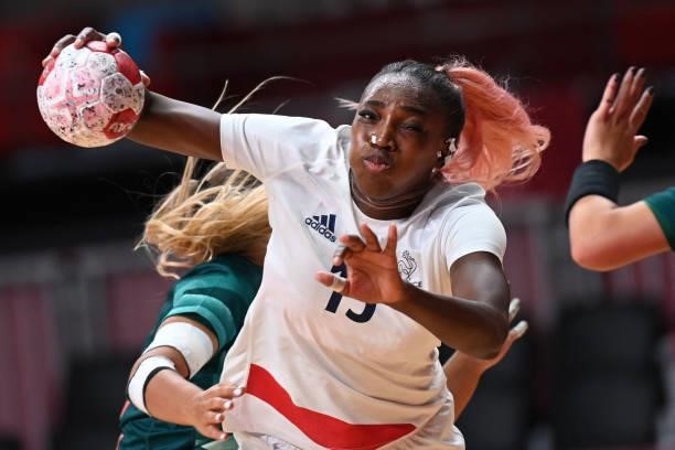 France's left back Kalidiatou Niakate is challenged during the women's preliminary round group B handball match between Hungary and France of the...