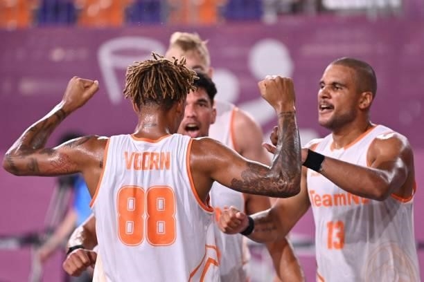 Netherland's team celebrates after wining the men's first round 3x3 basketball match between Netherlands and China at the Aomi Urban Sports Park in...