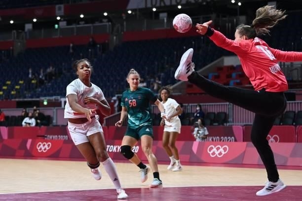 France's left wing Chloe Valentini shoots during the women's preliminary round group B handball match between Hungary and France of the Tokyo 2020...