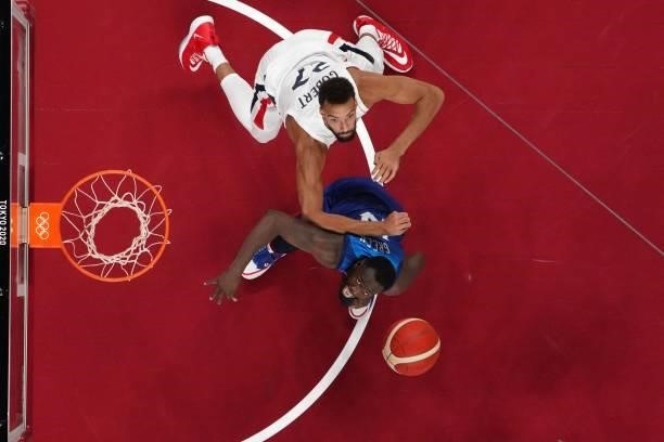 France's Rudy Gobert and USA's Draymond Jamal Green fight for the ball in the men's preliminary round group A basketball match between France and USA...