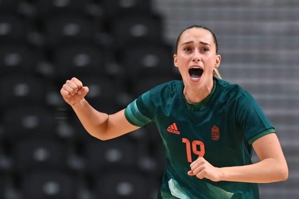 Hungary's left wing Greta Marton celebrates after scoring during the women's preliminary round group B handball match between Hungary and France of...