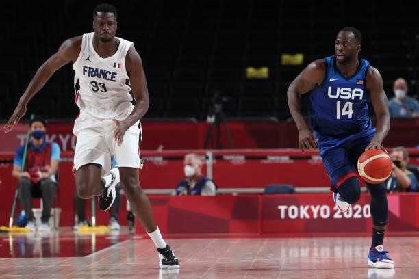 S Draymond Jamal Green dribbles the ball past France's Moustapha Fall in the men's preliminary round group A basketball match between France and USA...