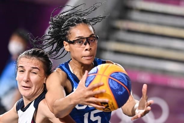 S Allisha Gray fights for the ball with Russia's Yulia Kozik during the women's first round 3x3 basketball match between Russia and US at the Aomi...
