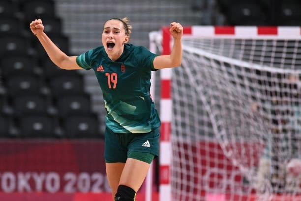 Hungary's left wing Greta Marton celebrates after scoring during the women's preliminary round group B handball match between Hungary and France of...